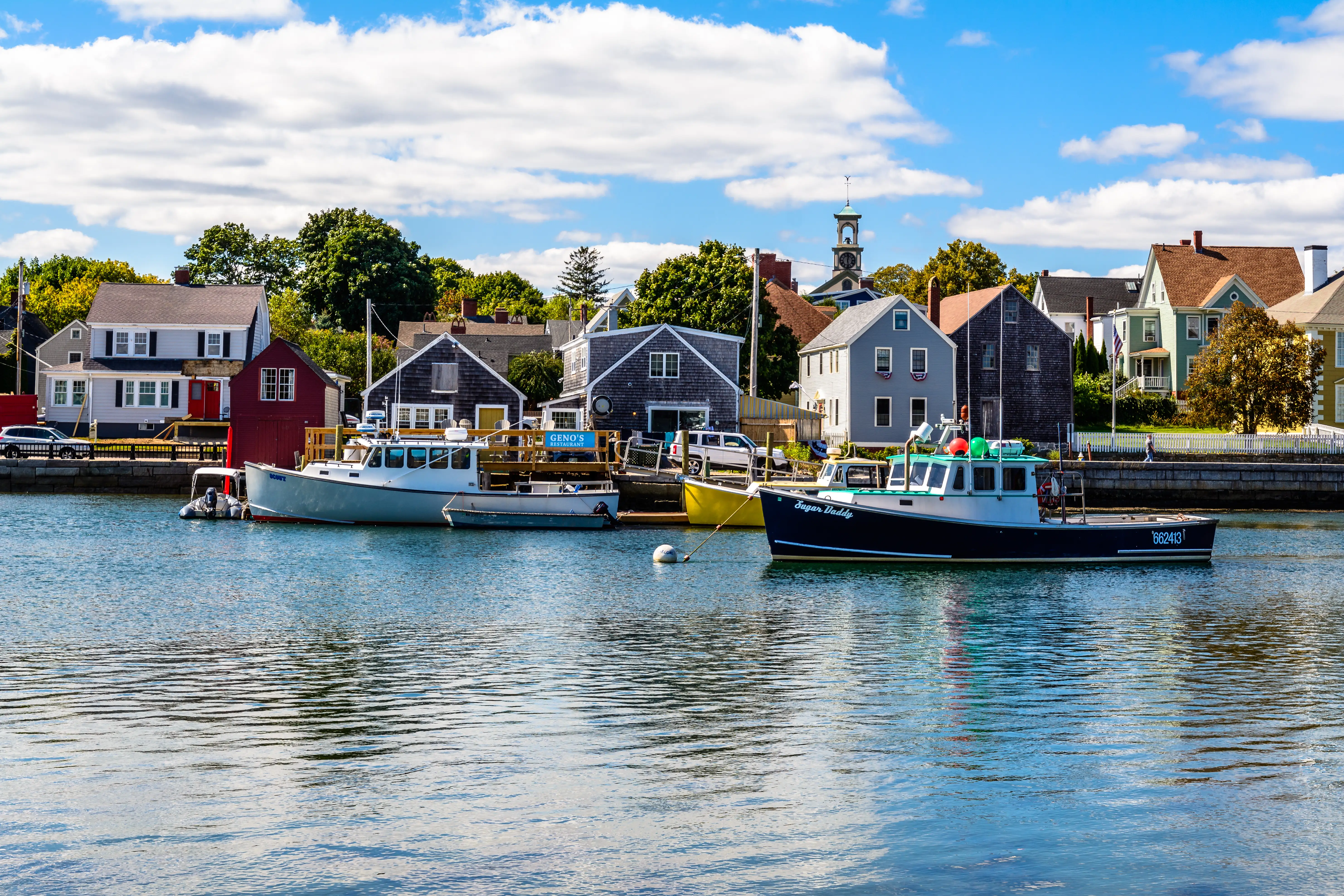 Fishing boats moored along the Portsmouth waterfront.